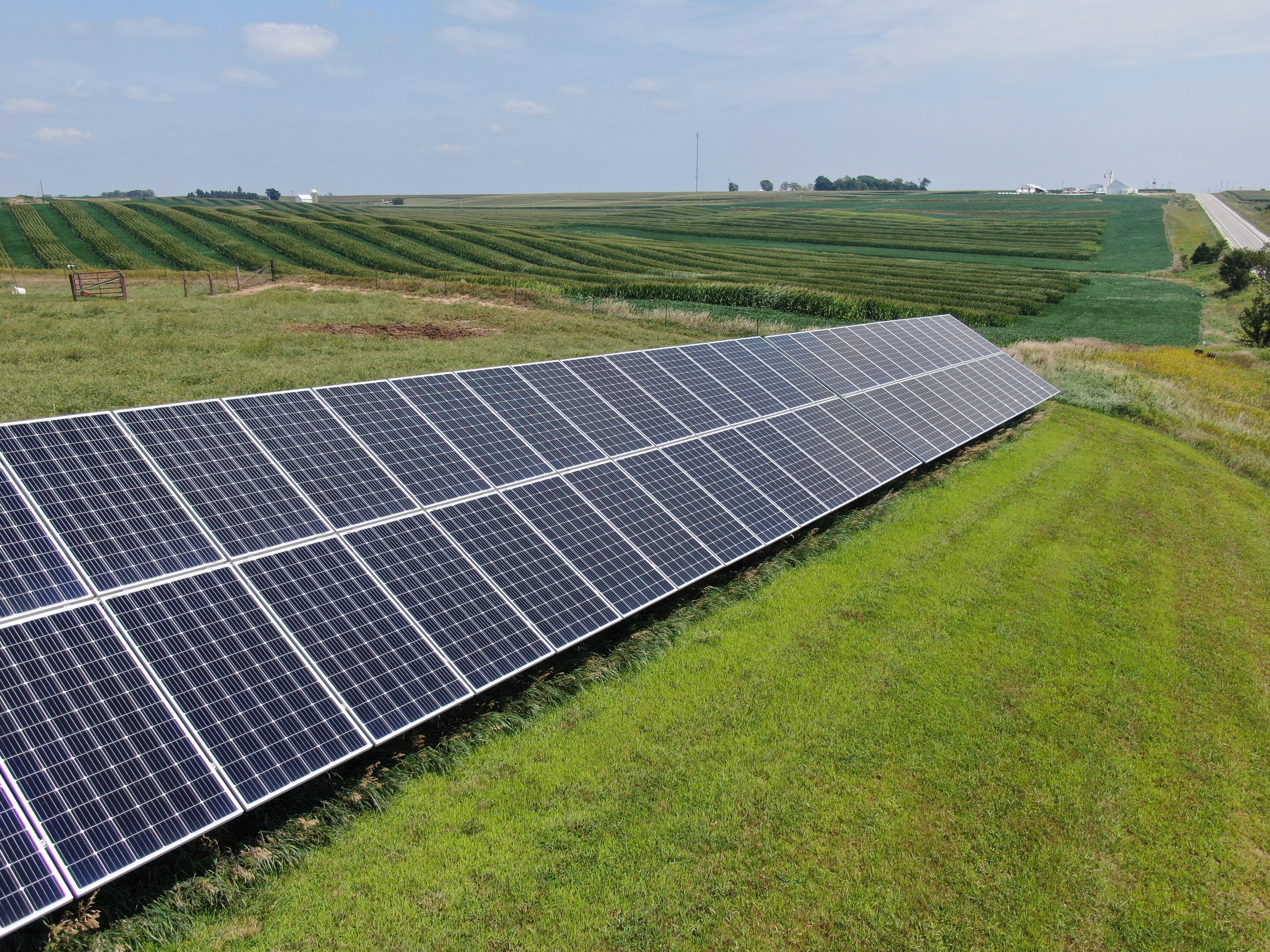 Photovoltaic solar panels beside agricultural fields